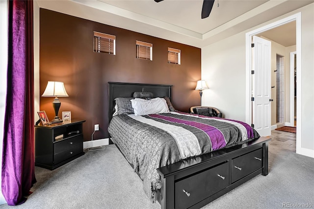 carpeted bedroom with baseboards and a ceiling fan