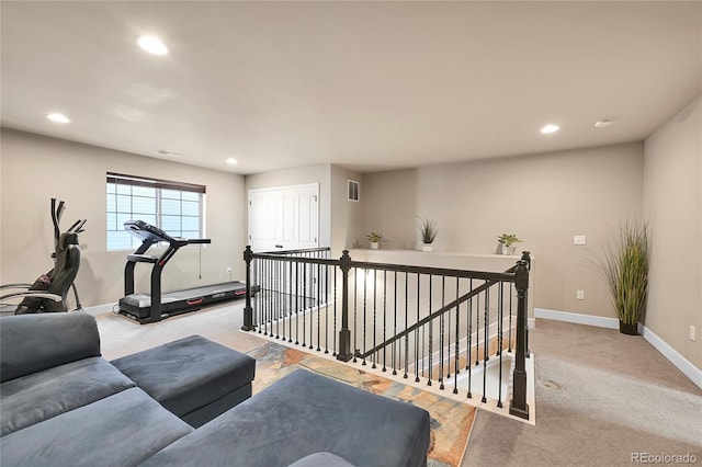 workout room featuring visible vents, recessed lighting, baseboards, and light carpet