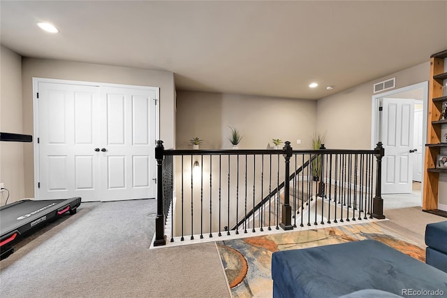 exercise area featuring recessed lighting, visible vents, and carpet