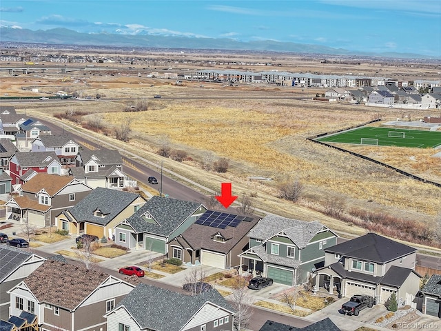 birds eye view of property with a mountain view and a residential view