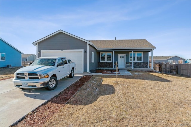 single story home with covered porch and a garage