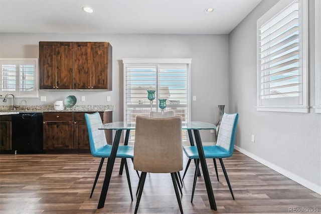 dining area featuring dark hardwood / wood-style flooring