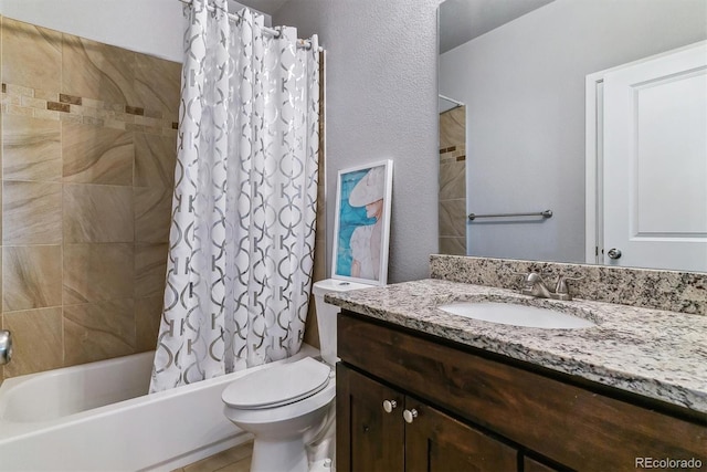 full bathroom with shower / tub combo, vanity, and toilet