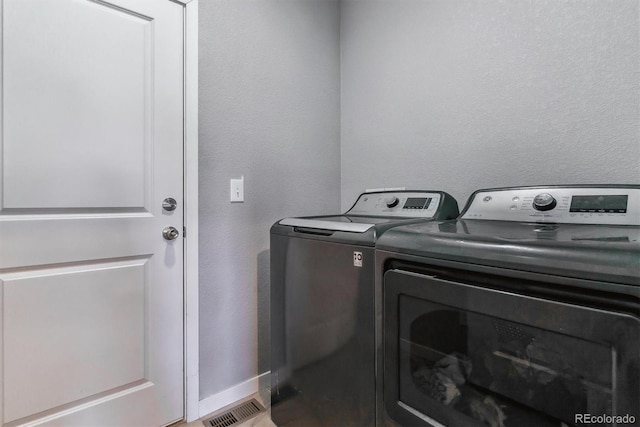 laundry room with washer and clothes dryer