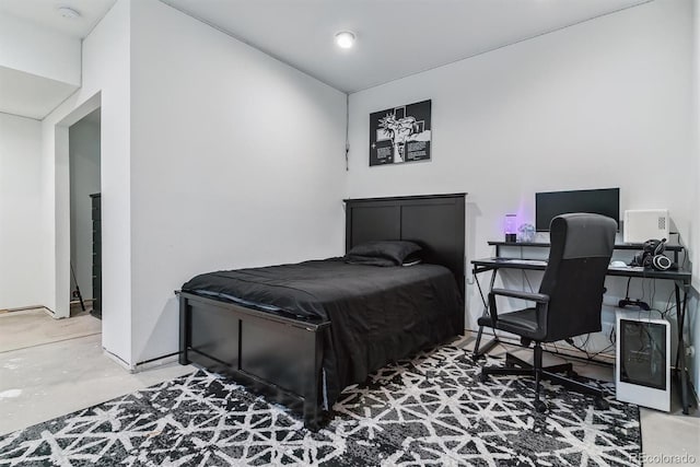 bedroom with concrete floors