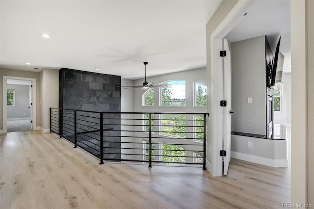 24031 E Hinsdale Pl, Aurora, CO 80016 - hallway featuring plenty of natural light, wood finished floors, baseboards, and recessed lighting
