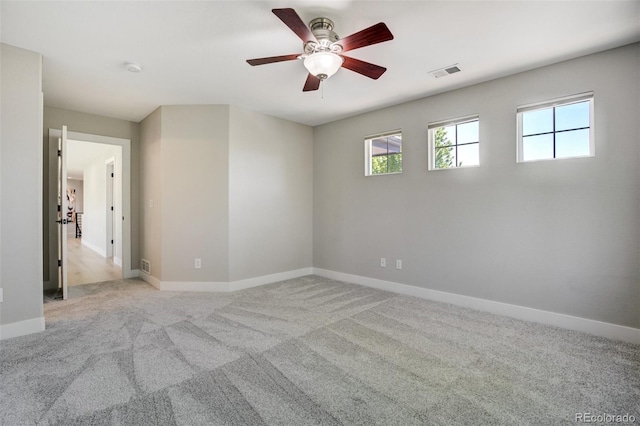 24031 E Hinsdale Pl, Aurora, CO 80016 - spare room featuring a ceiling fan, light carpet, and baseboards
