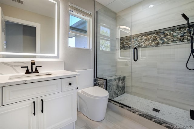 24031 E Hinsdale Pl, Aurora, CO 80016 - full bathroom featuring a stall shower, vanity, and toilet