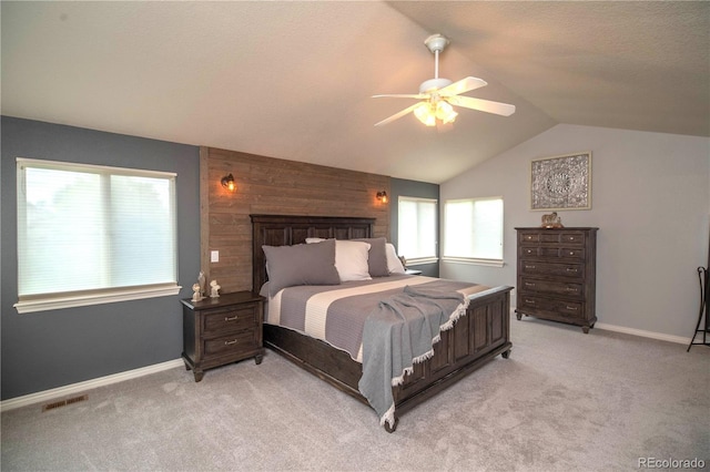 14962 Williams St, Thornton, CO 80602 - bedroom with vaulted ceiling, light carpet, baseboards, a ceiling fan, and wood walls