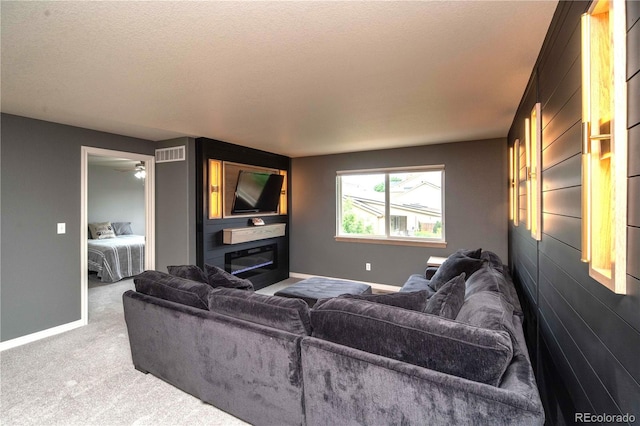 14962 Williams St, Thornton, CO 80602 - carpeted living room featuring baseboards, a textured ceiling, and a ceiling fan