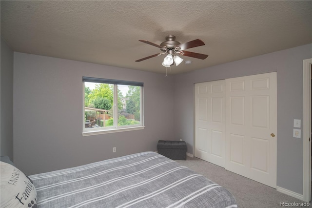 14962 Williams St, Thornton, CO 80602 - bedroom featuring a closet, carpet floors, baseboards, ceiling fan, and a textured ceiling