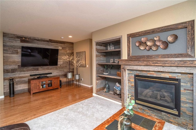 14962 Williams St, Thornton, CO 80602 - living room featuring a stone fireplace, wood finished floors, and recessed lighting