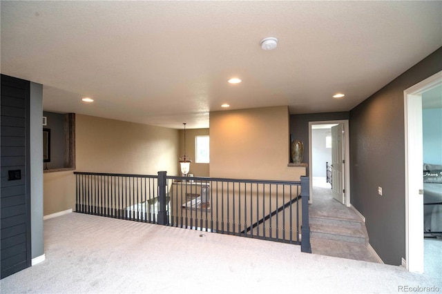 14962 Williams St, Thornton, CO 80602 - hall featuring carpet floors, recessed lighting, baseboards, and an upstairs landing