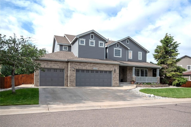 14962 Williams St, Thornton, CO 80602 - traditional home featuring a porch, concrete driveway, brick siding, and a garage