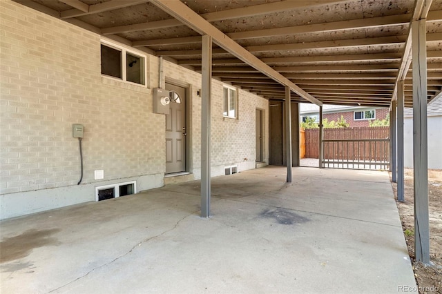 view of patio / terrace featuring fence