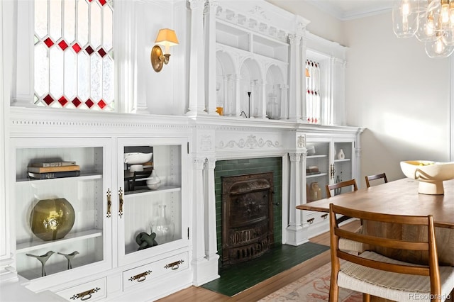 interior space with crown molding, wood-type flooring, and plenty of natural light