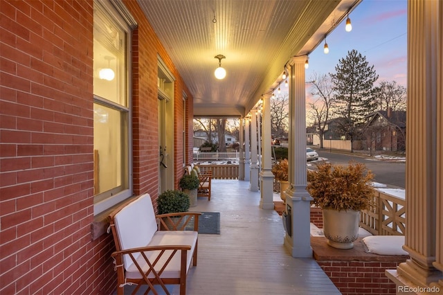 patio terrace at dusk with a porch