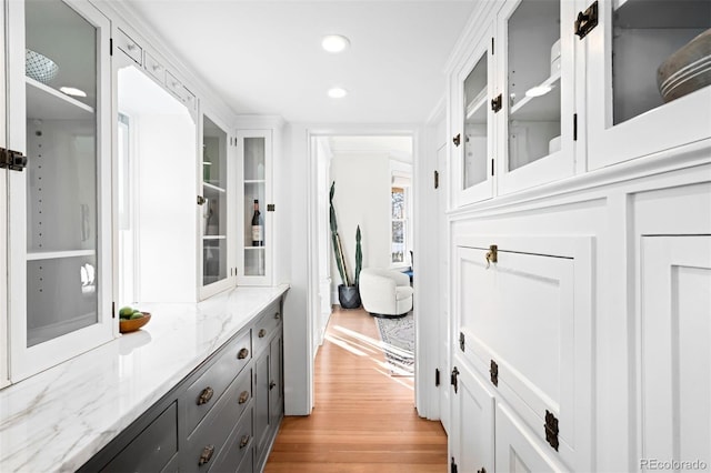 corridor with light hardwood / wood-style floors