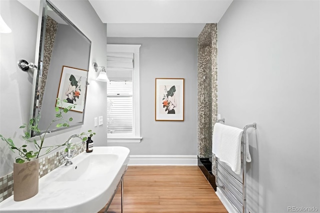 bathroom with hardwood / wood-style flooring