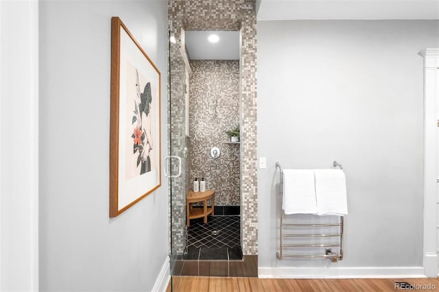 bathroom with hardwood / wood-style flooring