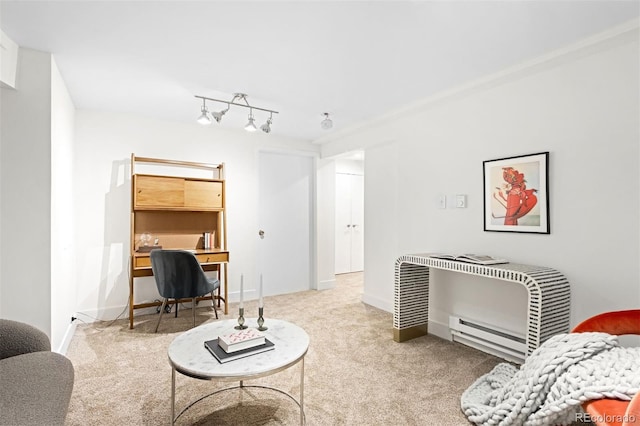 living room featuring a baseboard heating unit, light colored carpet, and track lighting