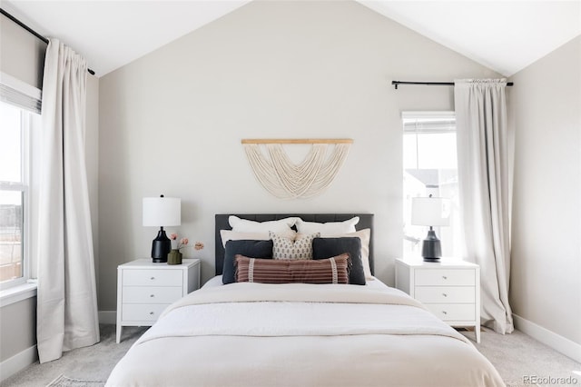 carpeted bedroom featuring lofted ceiling