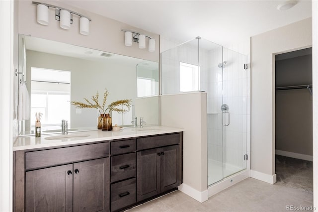 bathroom featuring vanity and a shower with shower door