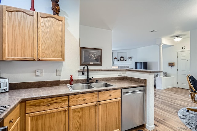 kitchen with light hardwood / wood-style flooring, dishwasher, sink, ornate columns, and kitchen peninsula