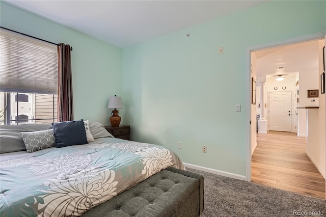 bedroom featuring light colored carpet