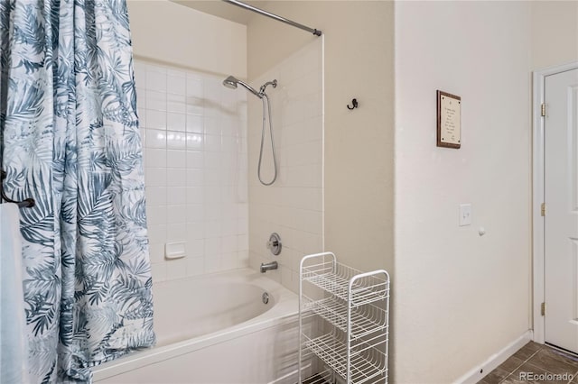 bathroom with shower / bath combination with curtain and tile patterned flooring