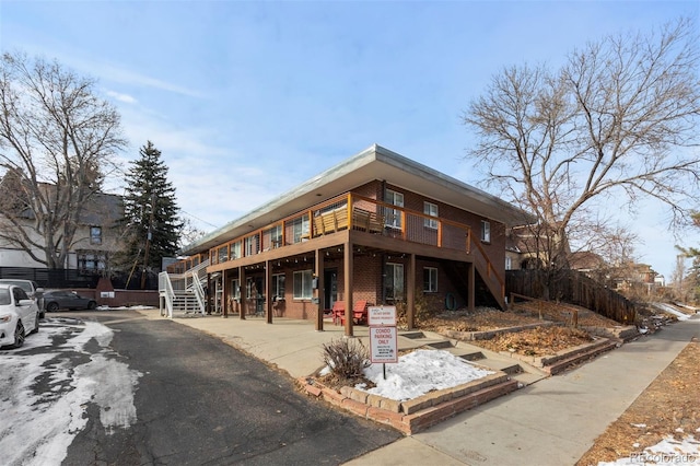 view of front of house with a wooden deck