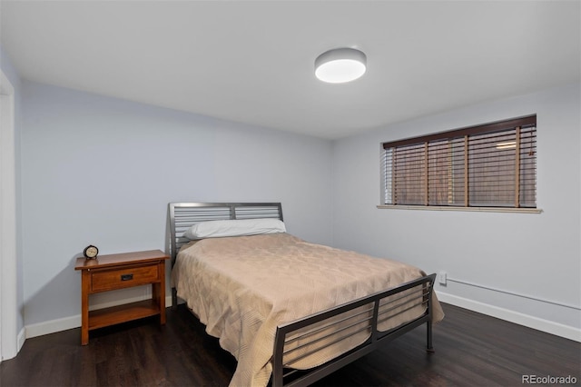 bedroom featuring dark hardwood / wood-style floors