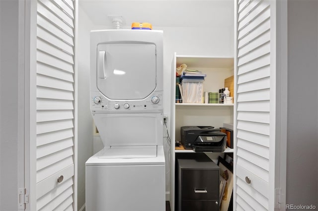 laundry area with stacked washer and clothes dryer