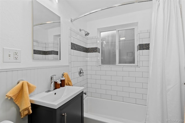 bathroom featuring vanity and shower / tub combo with curtain