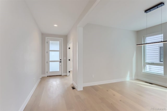 unfurnished room featuring light hardwood / wood-style flooring