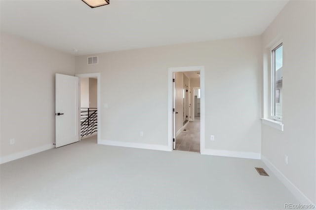 unfurnished bedroom with light carpet