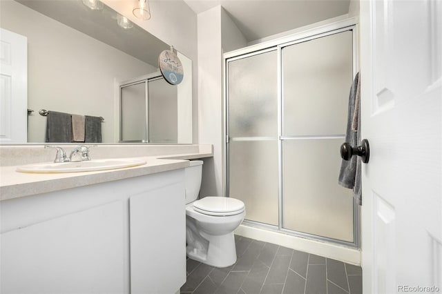 bathroom with toilet, walk in shower, tile patterned floors, and vanity