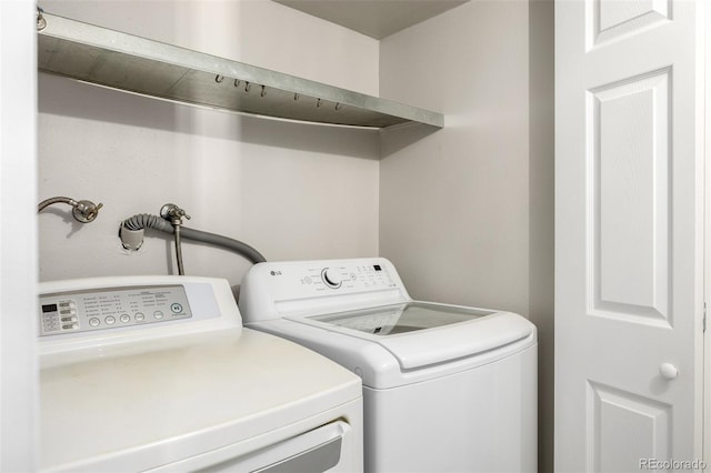 laundry area with washing machine and dryer