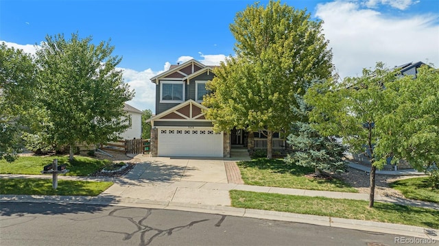 view of front of house with a garage and a front lawn