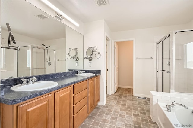 bathroom with vanity and independent shower and bath