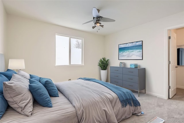 bedroom featuring ceiling fan and light colored carpet