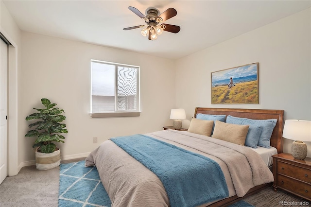 bedroom featuring ceiling fan, a closet, and carpet floors