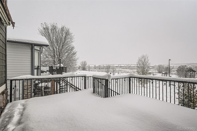 view of snow covered deck