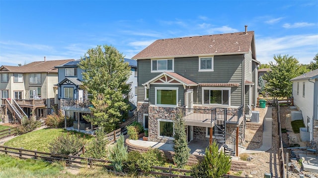 rear view of property featuring a patio