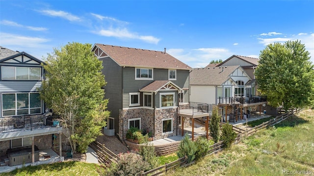 rear view of property with a balcony