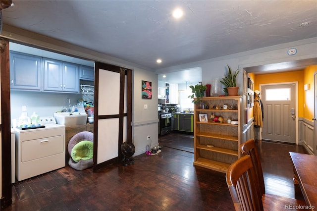 interior space featuring washer / dryer, dark hardwood / wood-style floors, and range