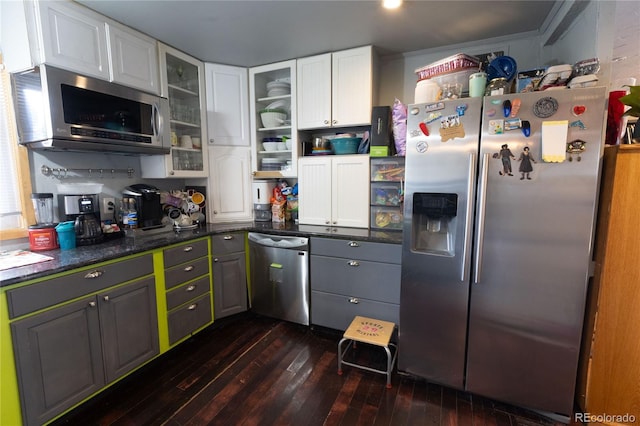 kitchen featuring white cabinetry, dark hardwood / wood-style flooring, and stainless steel appliances