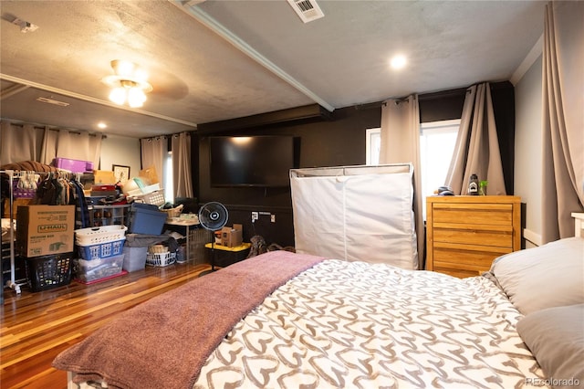 bedroom featuring ceiling fan and hardwood / wood-style flooring