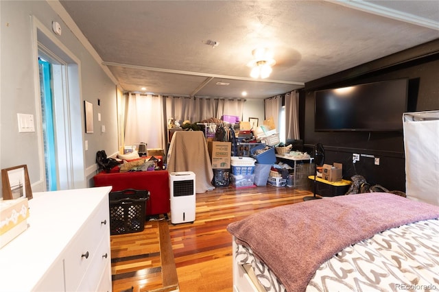 bedroom with light hardwood / wood-style floors