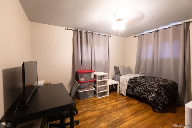 bedroom featuring hardwood / wood-style floors